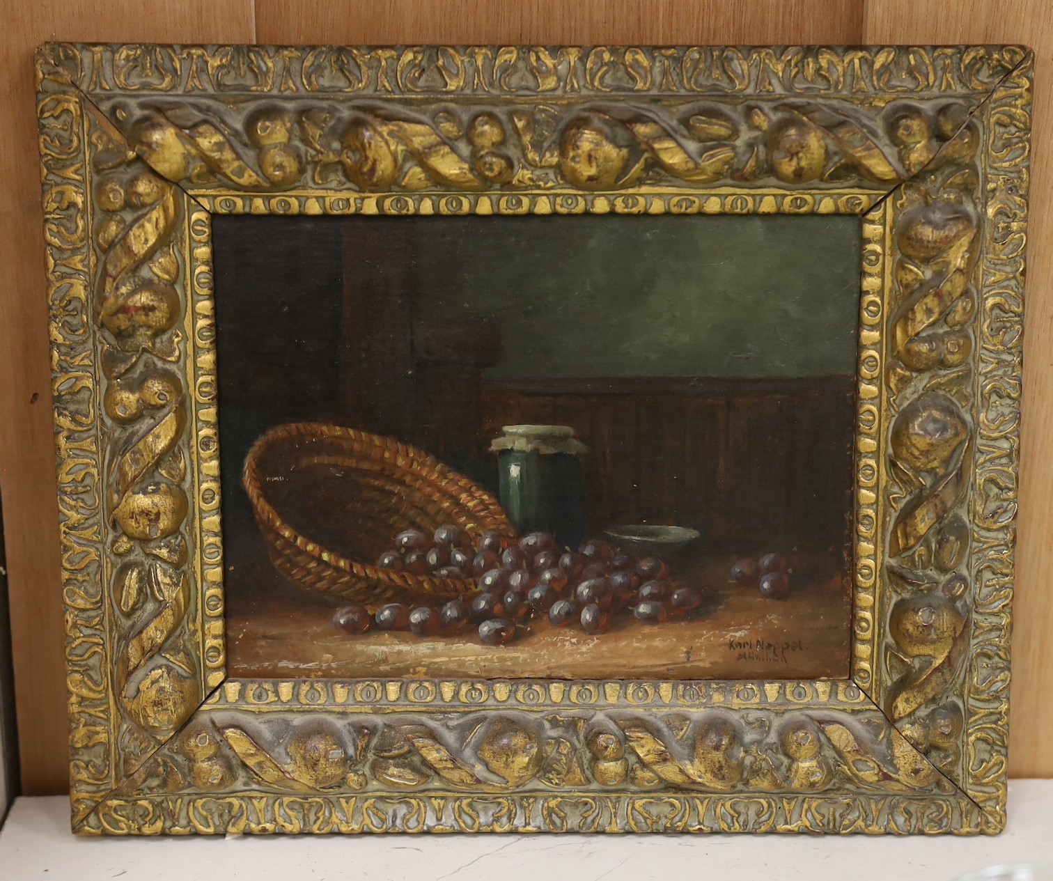 Karl Neppel (German, 1883-1961), oil on board, Still life of grapes on a table top, signed, 13 x 17.5cm